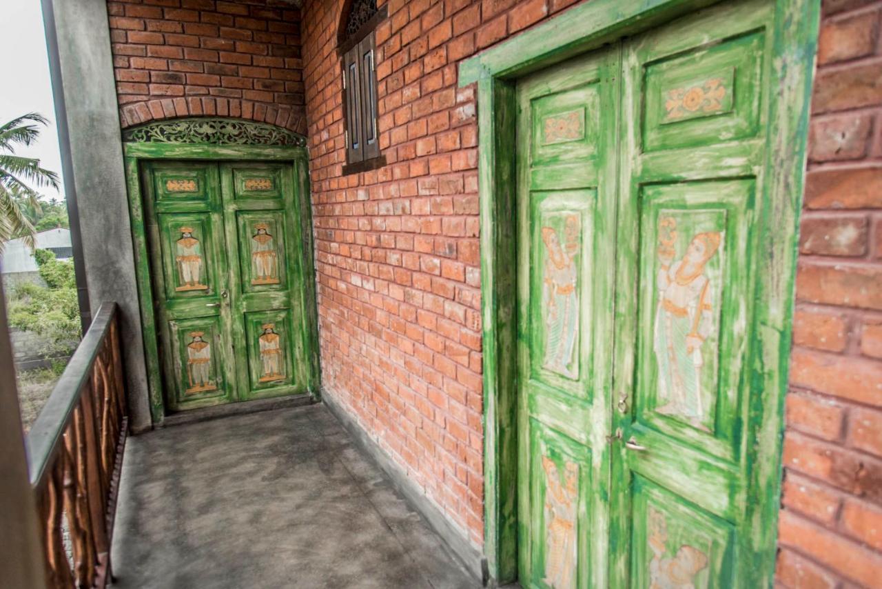 Negombo Boutique Villa Exterior photo Doors of a house in the village