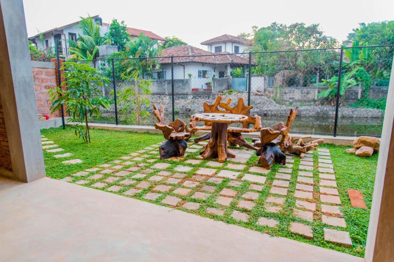 Negombo Boutique Villa Exterior photo A garden in Sri Lanka